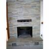 Stacked stone fireplace with quartz hearth 