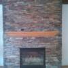 Beautiful ledger panel fireplace with new mantel.