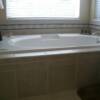 Master bathroom tub surround with hidden access panel.Matching porcel