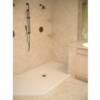 Huge master bathroom shower  with porcelain wall and floor tile and granite border to match the counter tops.