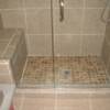 2 x 2 custom poured shower pan with contrasting 12 x 12 tile on walls and floor.