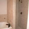 Nice 6 x 6 porcelain shower and tub combination in a master bathroom that is very functional.