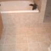 12 x 12  porcelain tile floor straight lay, with a tursurround of 6 x 6 porcelain tile.